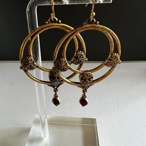Ornate brass drop earrings with red stone